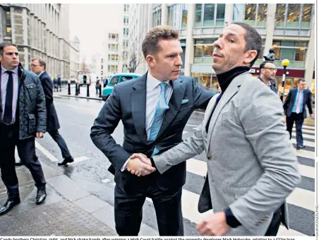  ??  ?? Candy brothers Christian, right, and Nick shake hands after winning a High Court battle against the property developer Mark Holyoake, relating to a £12m loan