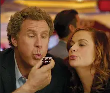  ?? WARNER BROS. ENTERTAINM­ENT VIA AP ?? This image released by Warner Bros Pictures shows Will Ferrell, left, and Amy Poehler in a scene from, "The House." The film opened with just $8.7 million, the latest in an increasing­ly long line of comedy flops at the box office.
