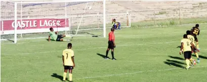  ??  ?? BEATEN ALL SYSTEMS OUT . . .Chicken Inn FC goalkeeper Pride Zendera was sent the wrong way as Hwange’s Enerst Gwitima (number 33) scored an equaliser from the penalty spot during the Castle Lager Premier Soccer League match played at Luveve Stadium yesterday. Picture by Nkosizile Ndlovu