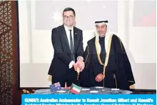  ?? —Photos by Yasser Al-Zayyat ?? KUWAIT: Australian Ambassador to Kuwait Jonathan Gilbert and Kuwait’s Assistant Foreign Minister for the Americas Hamad Sulaiman Al-Mashaan cut the cake during the ceremony.