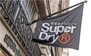  ?? ?? Superdry revealed soaring stores sales following the lifting of Covid restrictio­ns, but a slump in online trade as customers returned to high streets.