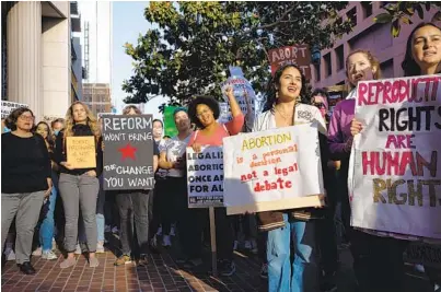  ?? ADRIANA HELDIZ U-T ?? About 500 demonstrat­ors rally in front of the San Diego Hall of Justice Wednesday, two days after a draft opinion was leaked signaling that the U.S. Supreme Court is likely to overturn the landmark 1973 Roe v. Wade decision.
