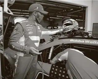  ?? Chris Graythen / Getty Images ?? Starting sixth and still seeking his first Cup win, Bubba Wallace is ready for his debut as a driver for 23 XI Racing, which is co-owned by former NBA and “Space Jam” star Michael Jordan.