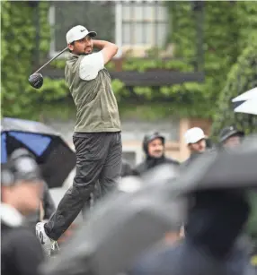  ?? AP ?? Jason Day hits off the 18th tee during the second round of the Wells Fargo Championsh­ip on Friday at TPC Potomac at Avenel Farm golf club in Potomac, Md.