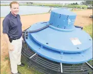  ?? GUARDIAN FILE PHOTO ?? Stratford Mayor David Dunphy shows off one of the town’s Blue Frog units at the sewage lagoon in this April 2014 photo.