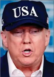  ??  ?? Mr Trump in his baseball cap yesterday DEFIANT: