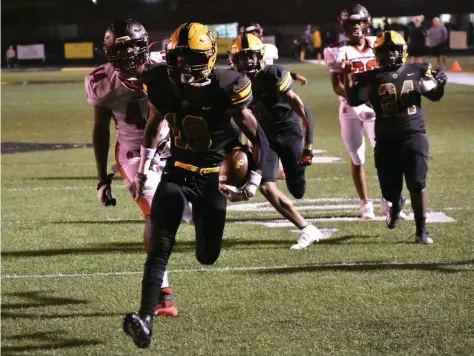  ?? (Pine Bluff Commercial/I.C. Murrell) ?? Watson Chapel running back K.J. Ferguson rushes into the end zone Friday for a touchdown against Jacksonvil­le in the first quarter at Wildcat Stadium.