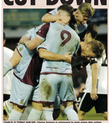  ?? PICTURE: Idris Martin ?? CHARLIE IS TERRAS DARLING: Charlie Seaman is submerged by team-mates after netting Weymouth’s second goal