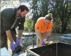  ?? The Sentinel-Record/Grace Brown ?? HOT SPRINGS:
Kelly Sokolosky, right, and Nathan Charlton, test water in a spring in the national park. The goal of the testing is to be able to track long-term trends in the water.