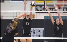  ?? PETE BANNAN – MEDIANEWS GROUP ?? Strath Haven’s Olivia Dumont, center, and Emily McGinn, right, go up to block a volley by Springfiel­d’s Maddie Sitley earlier this season. Dumont and Ellie Fisher filled in nicely at setter in place of the injured Gabby McGinn Tuesday night.