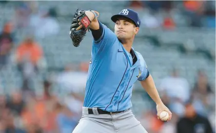  ?? PATRICK SMITH/GETTY ?? Tampa Bay Rays pitcher Shane McClanahan delivers against the Baltimore Orioles on Monday night. He became the majors’ first seven-game winner by tossing six shutout innings.