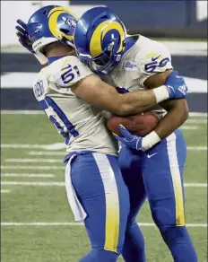  ?? Getty images ?? rams middle linebacker Micah Kiser, right, celebrates recovering a fumble during the fourth quarter of the NFC Wild Card playoff game against the seattle seahawks.