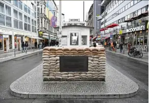  ?? — aFP ?? Checkpoint Charlie is a former checkpoint connecting the former us sector with the soviet union sector in then divided berlin, Germany.