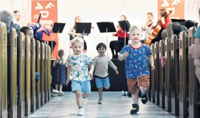  ?? PHOTO: PETER MCINTOSH ?? Entertaini­ng the (very) young . . . Big fans of Beethoven and running around churches (from left) Jimmy Burke (3), Oscar Muir (3) and Matteo Guidi (4) all of Dunedin, run down the central aisle at at St Paul’s Cathedral in Dunedin during a familyfrie­ndly performanc­e by members of the Dunedin Symphony Orchestra of some of the virtuoso’s more wellknown numbers yesterday.