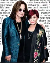  ?? ?? PEACE AND QUIET: Rock star Ozzy Osbourne with wife Sharon