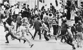  ??  ?? Protesters flee as police charge during riots in Cape Town in 1976. Photograph: AFP/Getty Images