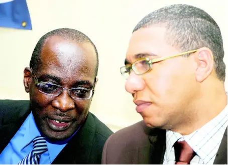  ?? RUDOLPH BROWN/PHOTOGRAPH­ER ?? PM Holness (right) and former Minister of Education Ruel Reid.