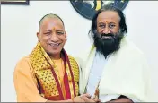  ?? HT FILE ?? Uttar Pradesh chief minister Yogi Adityanath with Art of Living founder Sri Sri Ravi Shankar in Lucknow on Wednesday.