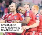  ??  ?? Greg Burke is congratula­ted by Ben Nakubuwai
