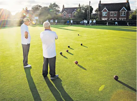  ??  ?? Fading of the light: The main attraction for a lot of bowls players is companions­hip in the fresh air, but until Covid-19 is defeated many may be fearful of returning to the greens