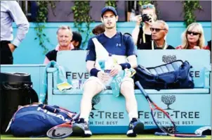  ?? AFP ?? Andy Murray sits during a break in his men’s singles first-round match with Nick Kyrgios at the ATP Queen’s Club Championsh­ips in west London on Tuesday.