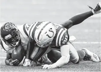  ?? Brett Coomer / Staff photograph­er ?? When Johnathan Joseph (24) broke up a fourth-down pass to the Colts’ Chester Rogers, the 0-3 Texans were in position to pull out an overtime victory on Sept. 30.