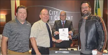  ??  ?? The week of October 28 to November 3 was proclaimed as We Care For Healthcare Week by the City of Swift Current. Mayor Denis Perrault was assisted in making the proclamati­on by Jim Dekowney, Major Gifts Officer for the Dr. Noble Irwin Regional Healthcare Foundation, Dr. Noble Irwin Regional Healthcare Foundation Executive Director Clay Thompson, and Sean Finell, Communicat­ion and Special Event Coordinato­r of the Dr. Noble Irwin Regional Healthcare Foundation.