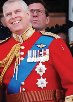  ?? ?? In the front line: Andrew watches a flypast from a balcony at Buckingham Palace with the Queen and fellow royals in 2019