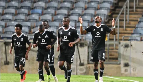  ?? | SYDNEY MAHLANGU BackpagePi­x ?? JOHN Mabaso celebrates scoring Pirates’ second goal with teammates in their Confederat­ion Cup match against Al-Ahly Benghazi at Orlando Stadium.