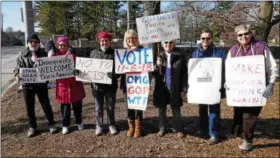  ?? FRAN MAYE — DIGITAL FIRST MEDIA ?? About a dozen people turned out for a women’s march along Route 1near Kendal at Longwood Saturday afternoon. The rally was in support of love and for equality for all people.