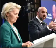  ?? (AP/Harry Nakos) ?? European Council President Charles Michel (right) and European Commission President Ursula von der Leyen address a media conference Thursday at an EU summit in Brussels.