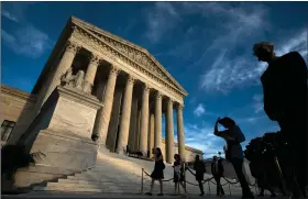  ?? (AP Photo/Jose Luis Magana) ?? Mourners pay their respects as Justice Ruth Bader Ginsburg lies in repose under the Portico at the top of the front steps of the U.S. Supreme Court building on Wednesday in Washington. Ginsburg, 87, died of cancer on Sept. 18.