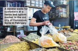  ??  ?? A vendor waits for customers at a herbs and spices market in the old city of Damascus, Syria in February