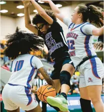  ?? ?? Princess Anne’s Jasiah Olds, left, strips the ball from Deep Creek’s Morgan Herbert as the Cavaliers’ Hailey Harris also defends on Friday night.