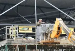  ?? STAFF PHOTO BY ERIN O. SMITH ?? A worker at the new Avondale Youth and Family Developmen­t Center site moves concrete blocks onto a platform to use in an upper area of the new facility Friday in Chattanoog­a.