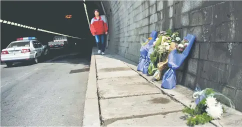  ??  ?? File photo shows flowers at the entrance of the Taojiakuan­g tunnel, the scene of a bus accident that killed 11 South Korean and Chinese kindergart­eners and their driver, in the city of Weihai in Shandong province. — AFP photo