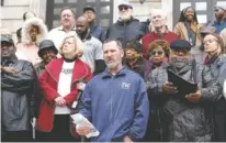  ?? STAFF PHOTO BY C.B. SCHMELTER ?? Organizer and president of Iron Workers Local Union No. 704 Daniel Potter, center, speaks Tuesday on the steps of City Hall during a public statement by the Unity Group of Chattanoog­a about the former Harriet Tubman site.