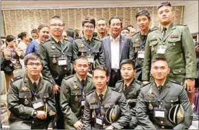  ?? SUPPLIED ?? Prime Minister Hun Sen (centre), Ly Chansochea­ta and Cambodian cadets in Japan.