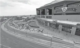  ?? MICHAEL CHOW/THE REPUBLIC ?? Very little traffic can be seen on Jefferson Street in front of Chase Field in Phoenix.