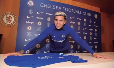  ?? CHELSEA FC ?? Enzo Fernández poses for a photograph after signing his contract with Chelsea.