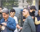  ?? Morteza Nikoubazl NurPhoto ?? U.S LAWMAKERS have been planning to financiall­y punish Iran. Above, a currency exchange in Tehran.