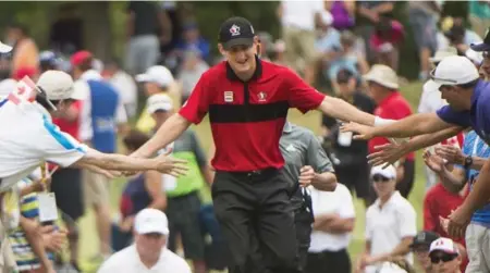  ?? NATHAN DENETTE/THE CANADIAN PRESS ?? Crowd-pleasing B.C. amateur Jared du Toit, in the last pairing for the final round of the Canadian Open, felt the love at Glen Abbey — but Jhonattan Vegas took home the hardware and just over $1 million.