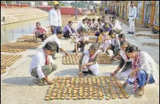  ?? PTI ?? Children from Muskan Rehabilita­tion Centre arrange lamps as part of preparatio­ns for ‘Deepotsav’ in Ayodhya on Saturday.
POST-COVID EFFECTS