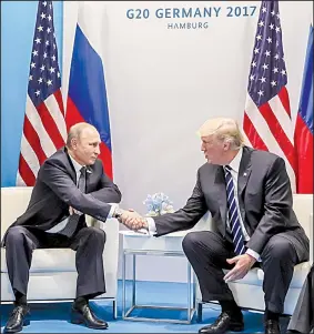  ?? AP/MIKHAIL KLIMENTYEV ?? President Donald Trump and Russian President Vladimir Putin meet for the first time Friday in Hamburg, Germany, at the Group of 20 summit.