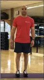  ?? (Arkansas Democrat-Gazette/Celia Storey) ?? CrossFit trainer Nick Stewart demonstrat­es Single Leg Balance With Rotation in Little Rock Racquet Club’s fitness studio.