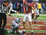  ?? CHRIS GRAYTHEN/GETTY ?? Alabama’s Jermaine Burton, right, stands over KSU’s Ekow Boye-Doe after scoring a touchdown in the Sugar Bowl on Saturday in New Orleans.