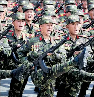  ?? AP/WONG MAYE-E ?? North Korean soldiers high-step across Pyongyang’s Kim Il Sung Square on Saturday in a parade celebratin­g the country’s founder and displaying an array of modern weaponry.