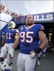  ?? ADRIAN KRAUS - THE ASSOCIATED PRESS ?? FILE - In this Oct. 22, 2017, file photo, Buffalo Bills defensive tackle Kyle Williams (95) and wide receiver Zay Jones (11) exit the tunnel prior to an NFL football game against the Tampa Bay Buccaneers, in Orchard Park, N.Y. Kyle Williams is putting...