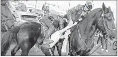  ?? AP/NJ Advance Media/ANDREW MILLS ?? A Philadelph­ia Eagles fan (above) was taken into custody Jan. 21 after being accused of punching a police horse before the NFC Championsh­ip Game.