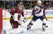  ?? AP ?? Coyotes goaltender Connor Ingram makes a save on Blue Jackets center Boone Jenner on Sunday.